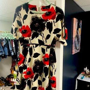 Ark and Co dress is white with a red and black floral print.